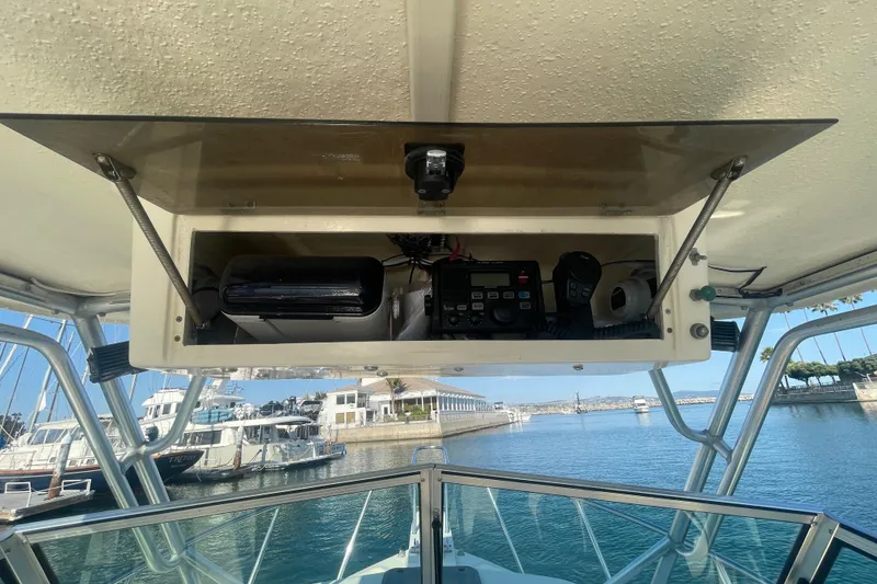 Slide: The Image of 2006 Parker 2310 boat console with electronics, docked at marina. - 12