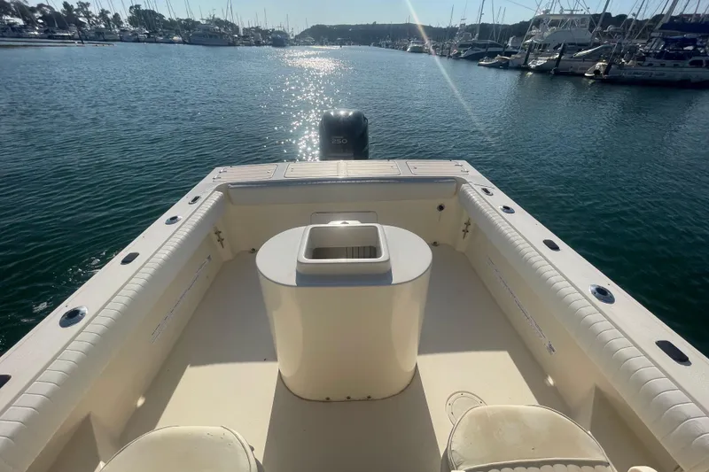 Slide: The Image of 2006 Parker 2310 boat on water, sunny day, marina in background. - 20