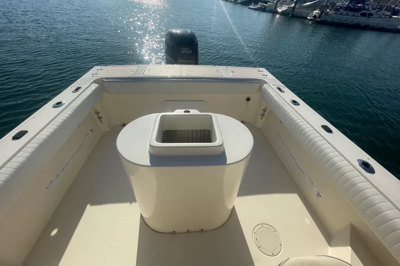 Slide: The Image of Parker 2310 boat deck, 2006 model, with Yamaha 250 engine, docked in sunny marina. - 21