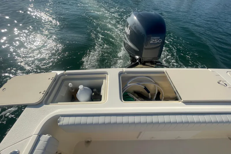Slide: The Image of Rear view of a 2006 Parker 2310 boat with Yamaha 250 outboard motor. - 22