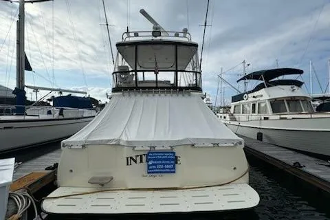 Slide: The Image of 1999 Mikelson 50 Sportfisher yacht docked at marina, rear view. - 3