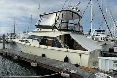 Slide: The Image of 1999 Mikelson 50 Sportfisher yacht docked at marina, side view. - 6