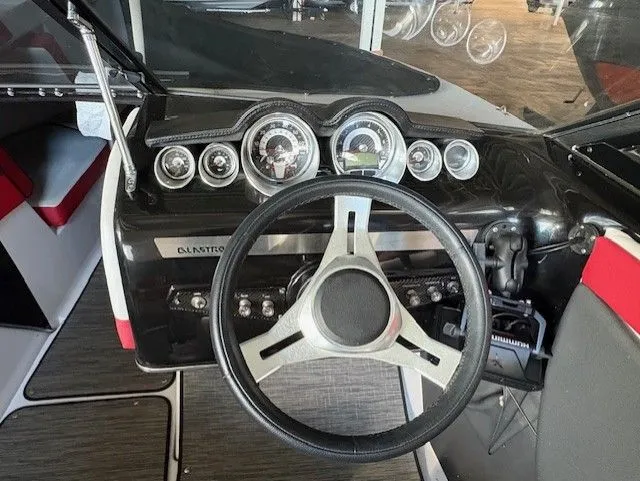 Slide: The Image of Dashboard of a 2019 Glastron 225 GTS boat with steering wheel. - 5