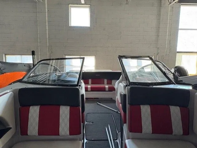 Slide: The Image of Interior of a 2019 Glastron 225 GTS boat with red and white seating. - 9