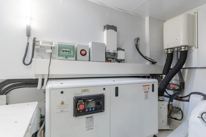 Slide: The Image of Engine room of 2023 Azimut Magellano 66 yacht with Kohler generator and electrical systems. - 12