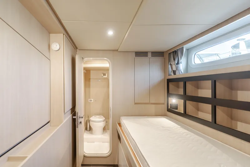 Slide: The Image of Luxurious interior of 2023 Azimut Magellano 66 yacht cabin with ensuite bathroom. - 15