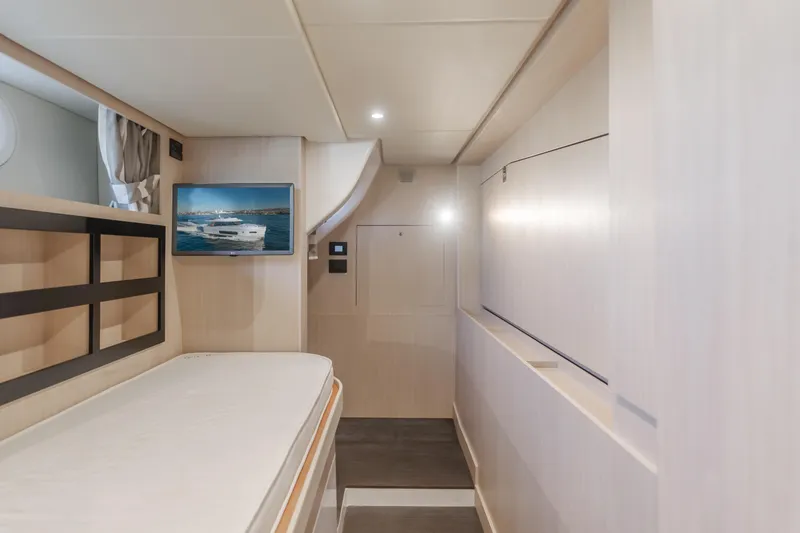 Slide: The Image of Interior of 2023 Azimut Magellano 66 yacht with modern design and wall-mounted TV. - 16