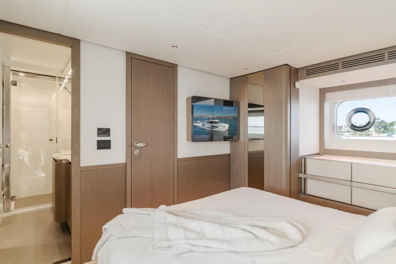 Slide: The Image of Luxurious interior of 2023 Azimut Magellano 66 yacht cabin with modern design and window view. - 23