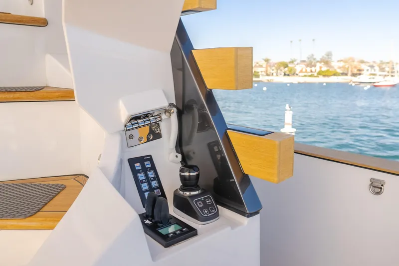 Slide: The Image of Control panel of 2023 Azimut Magellano 66 yacht with scenic water view. - 28