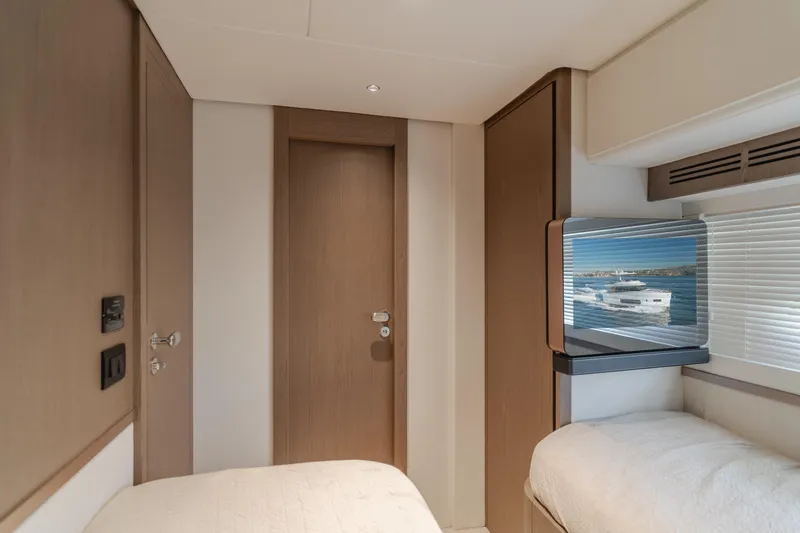 Slide: The Image of 2023 Azimut Magellano 66 yacht interior with modern design and window view. - 40