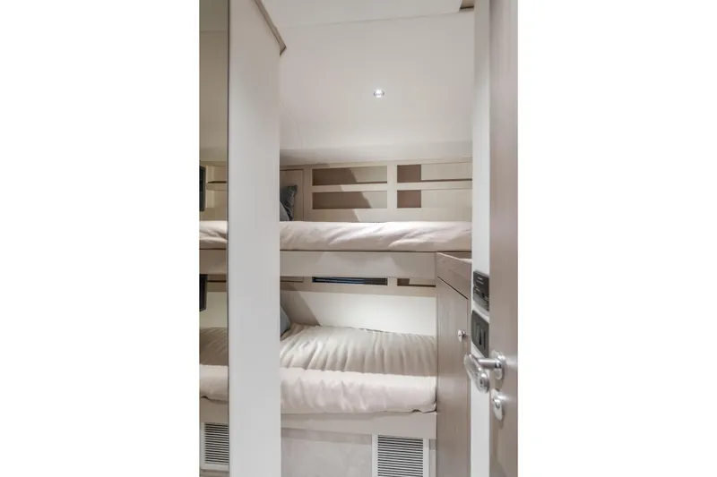 Slide: The Image of Interior of 2023 Azimut Magellano 66 yacht featuring cozy bunk beds. - 41