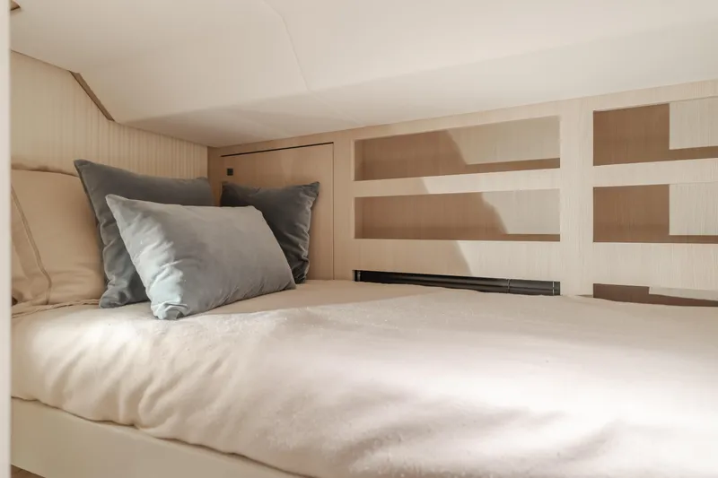 Slide: The Image of Cozy bedroom interior of 2023 Azimut Magellano 66 yacht with plush pillows. - 42