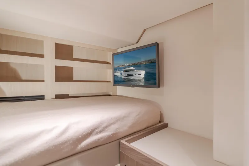 Slide: The Image of Interior of 2023 Azimut Magellano 66 yacht with bed and wall-mounted TV. - 43