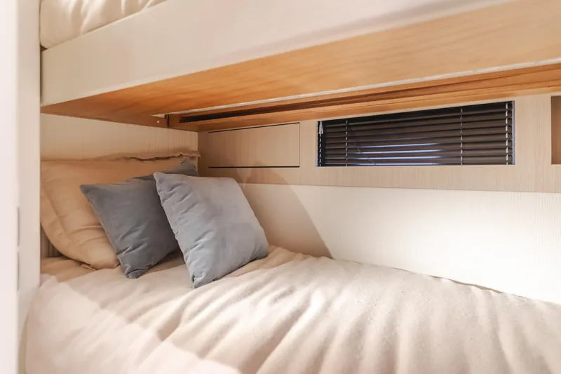 Slide: The Image of Cozy bunk bed with pillows in 2023 Azimut Magellano 66 yacht cabin. - 44