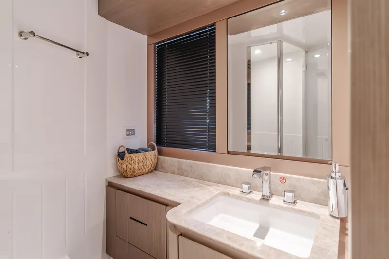 Slide: The Image of Luxurious bathroom in 2023 Azimut Magellano 66 yacht with modern fixtures and elegant design. - 46