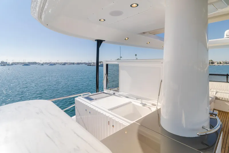 Slide: The Image of Luxurious 2023 Azimut Magellano 66 yacht deck with ocean view and sleek design. - 58