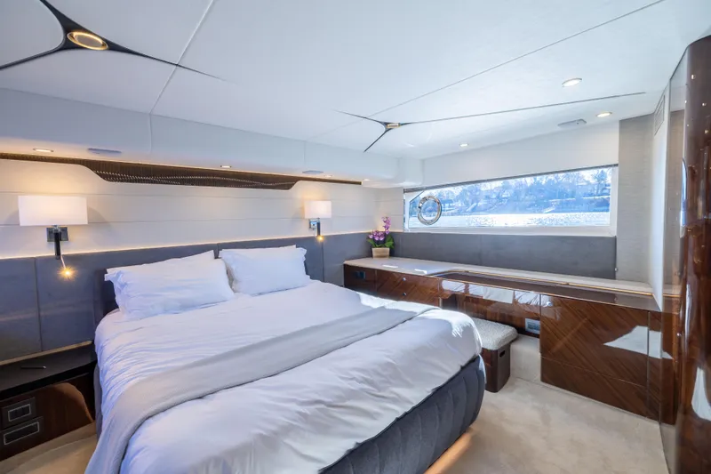 Slide: The Image of Luxurious bedroom interior of 2026 Fairline 58 GTO yacht with modern design and large window. - 19