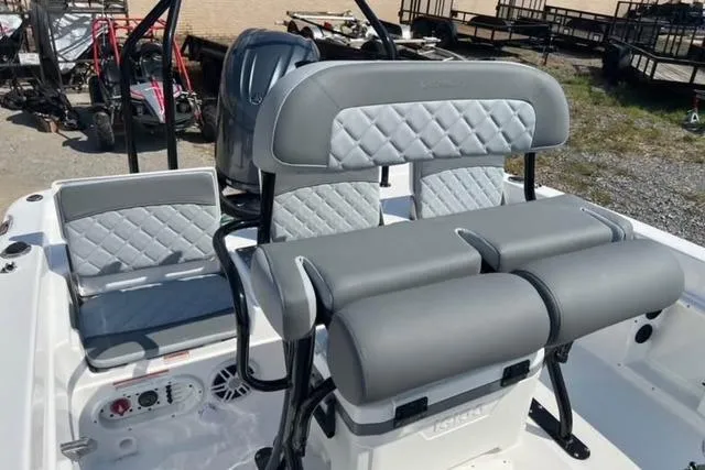 Slide: The Image of 2026 NauticStar 211 Hybrid boat interior with gray cushioned seating and modern design. - 4