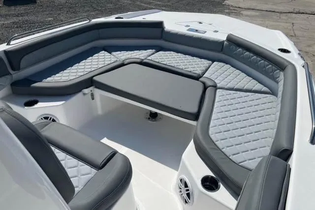 Slide: The Image of 2026 NauticStar 211 Hybrid boat with spacious, cushioned seating and modern design. - 6