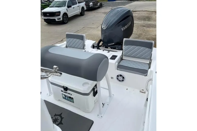 Slide: The Image of 2026 NauticStar 191 Hybrid boat interior with Yamaha engine and seating. - 4