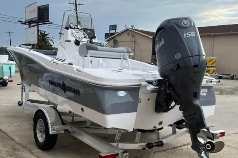 Slide: The Image of 2026 NauticStar 191 Hybrid boat on trailer with Yamaha 150 outboard motor. - 7