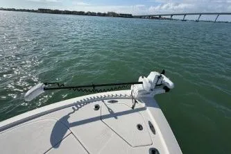 Slide: The Image of 2024 SeaVee 270Z boat on water with bridge in background. - 11