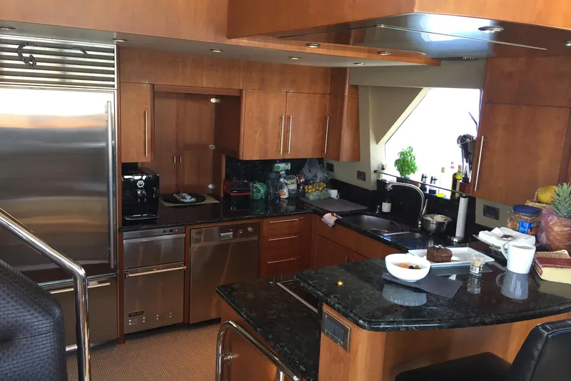 Slide: The Image of Luxurious kitchen interior of 2006 Northcoast Yachts Yachtfisher with modern appliances and wood cabinetry. - 10