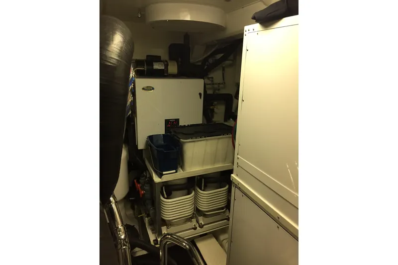 Slide: The Image of Luxurious interior hallway of 2006 Northcoast Yachts Yachtfisher with elegant lighting and carpeted stairs. - 18