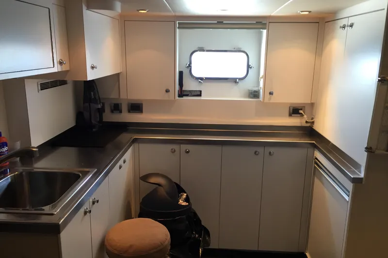 Slide: The Image of Luxurious bedroom interior of 2006 Northcoast Yachts Yachtfisher, featuring elegant wood finishes. - 20