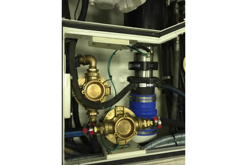 Slide: The Image of Luxurious bathroom in 2006 Northcoast Yachts Yachtfisher, featuring dual sinks and glass shower. - 21