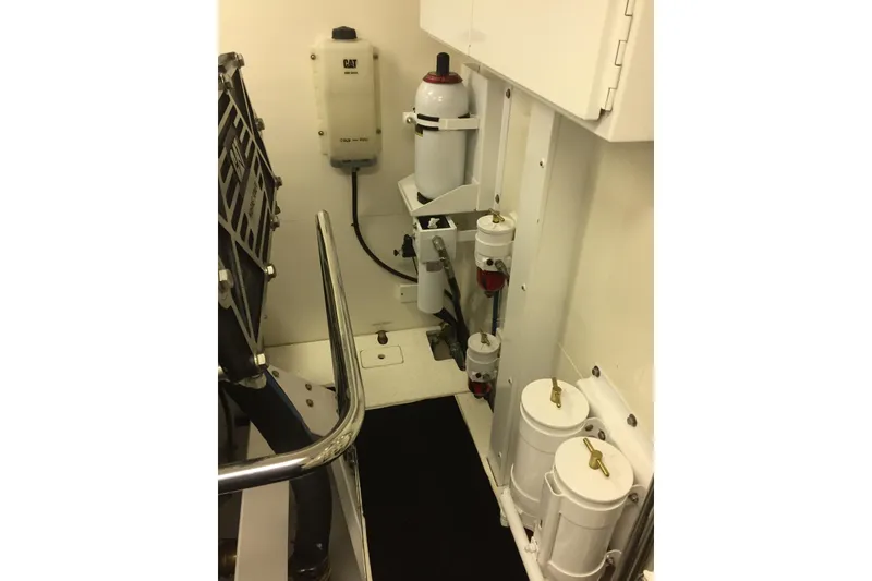 Slide: The Image of Luxurious 2006 Northcoast Yachts Yachtfisher interior cabin with wood finishes and cozy bedding. - 27