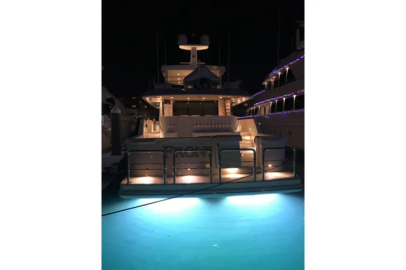 Slide: The Image of 2006 Northcoast Yachts Yachtfisher docked at marina, clear blue sky, waterfront homes. - 30