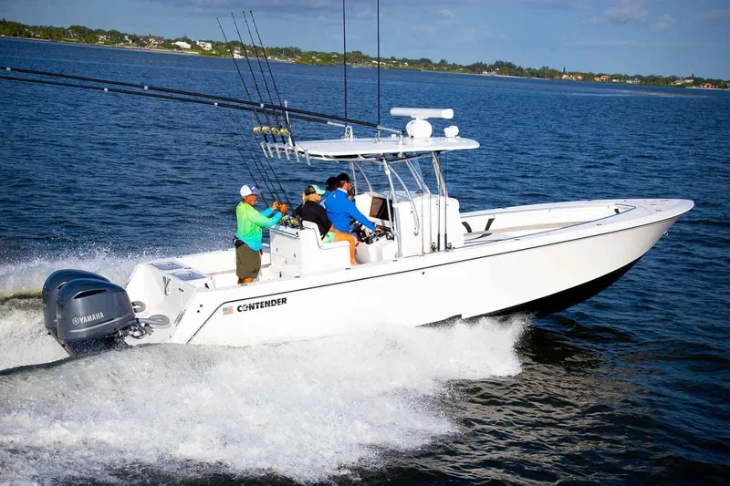 Slide: The Image of Manufacturer Provided Image: 2020 Contender 32 ST boat cruising on the water with fishing rods. - 102