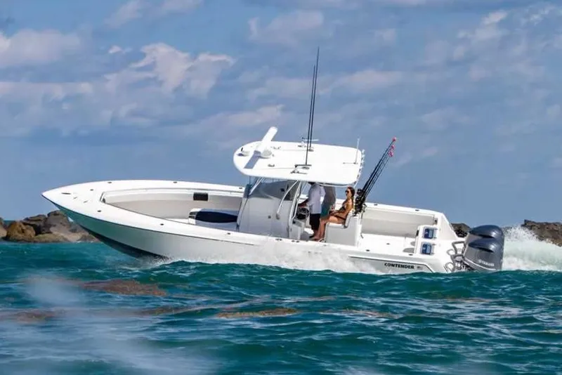 Slide: The Image of Manufacturer Provided Image: 2020 Contender 32 ST boat cruising on the ocean with passengers. - 103