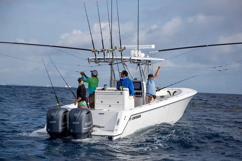Slide: The Image of Manufacturer Provided Image: 2020 Contender 32 ST fishing boat with anglers on open water. - 108