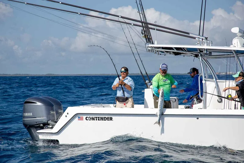Slide: The Image of Manufacturer Provided Image: Anglers fishing on a 2020 Contender 32 ST boat in the ocean. - 109