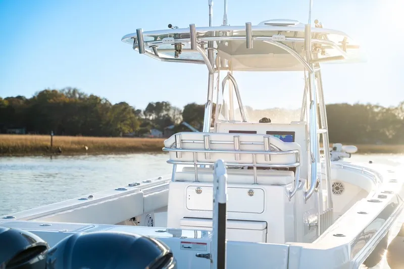 Slide: The Image of 2020 Contender 32 ST boat on calm water, featuring sleek design and modern equipment. - 14