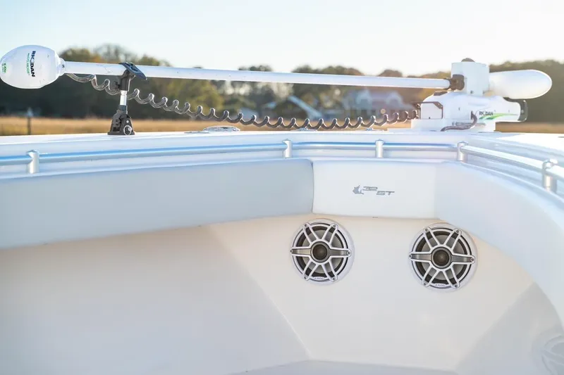 Slide: The Image of 2020 Contender 32 ST boat with speakers and trolling motor, sunny outdoor setting. - 18