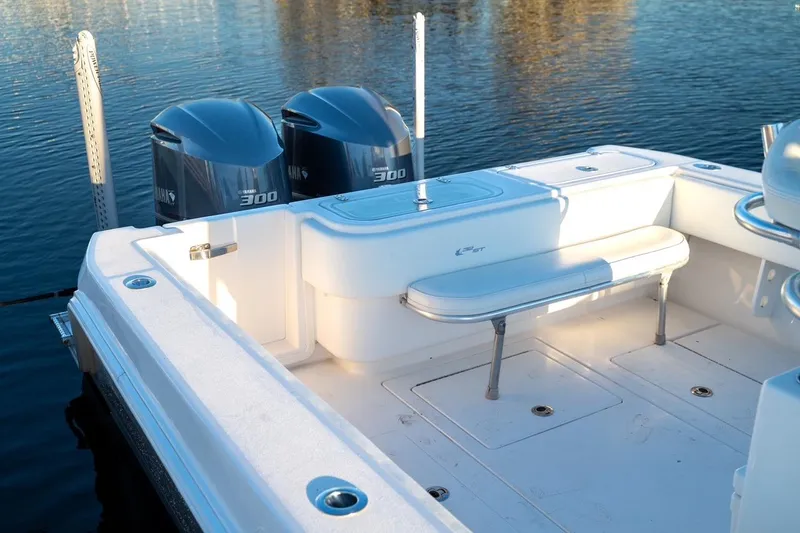 Slide: The Image of 2020 Contender 32 ST boat with twin Yamaha 300 engines on calm water. - 23