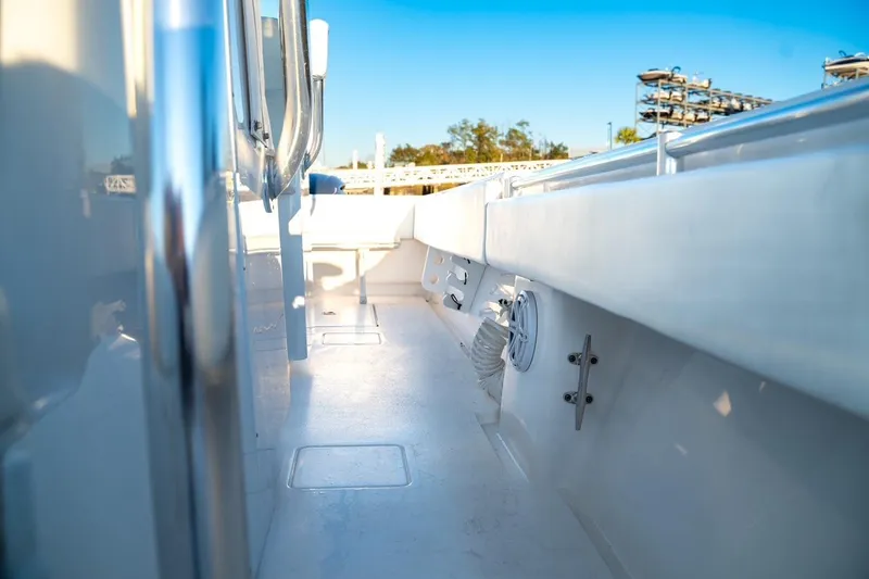 Slide: The Image of 2020 Contender 32 ST boat interior with sleek white deck and railing. - 28