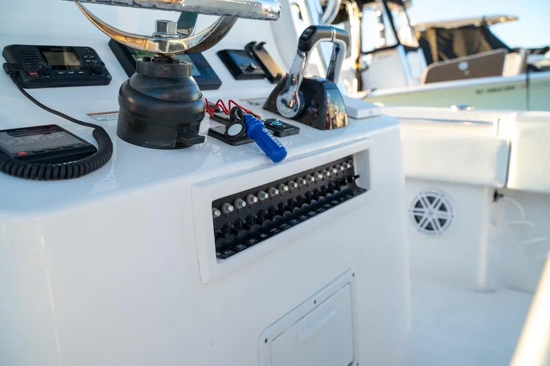 Slide: The Image of Control panel of a 2020 Contender 32 ST boat with navigation equipment. - 32