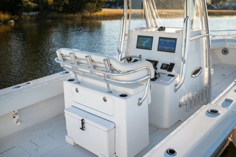 Slide: The Image of 2020 Contender 32 ST boat interior with helm, dual screens, and seating. - 33