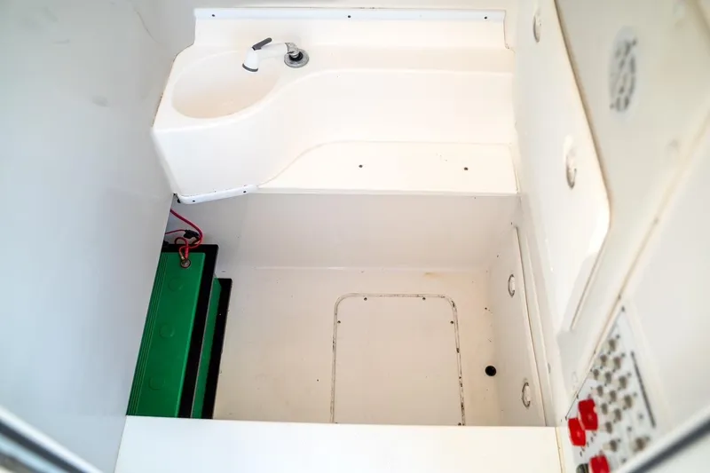 Slide: The Image of 2020 Contender 32 ST boat interior with sink and control panel. - 35