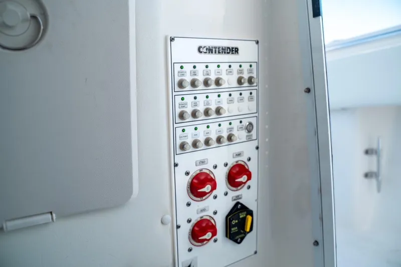 Slide: The Image of Control panel of 2020 Contender 32 ST boat with switches and dials. - 37
