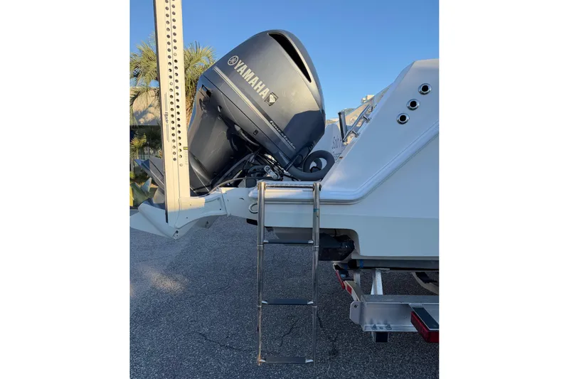 Slide: The Image of 2020 Contender 32 ST boat with Yamaha outboard motor and ladder. - 50