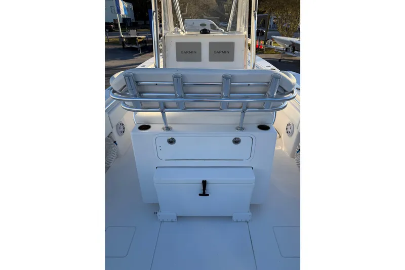 Slide: The Image of 2020 Contender 32 ST boat interior with Garmin electronics and storage compartments. - 55
