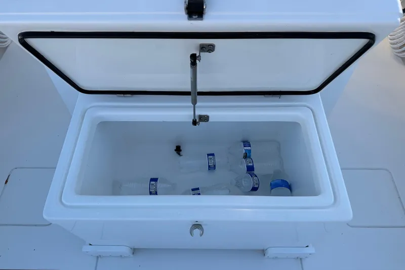 Slide: The Image of Open cooler with water bottles on a 2020 Contender 32 ST boat. - 57