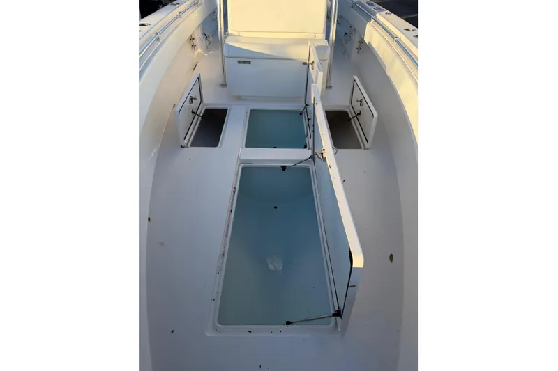Slide: The Image of 2020 Contender 32 ST boat interior with open storage compartments. - 60