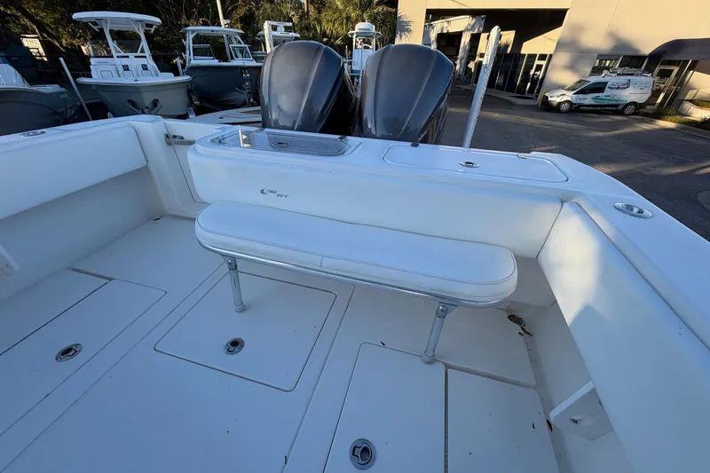 Slide: The Image of 2020 Contender 32 ST boat interior with seating and dual engines. - 62