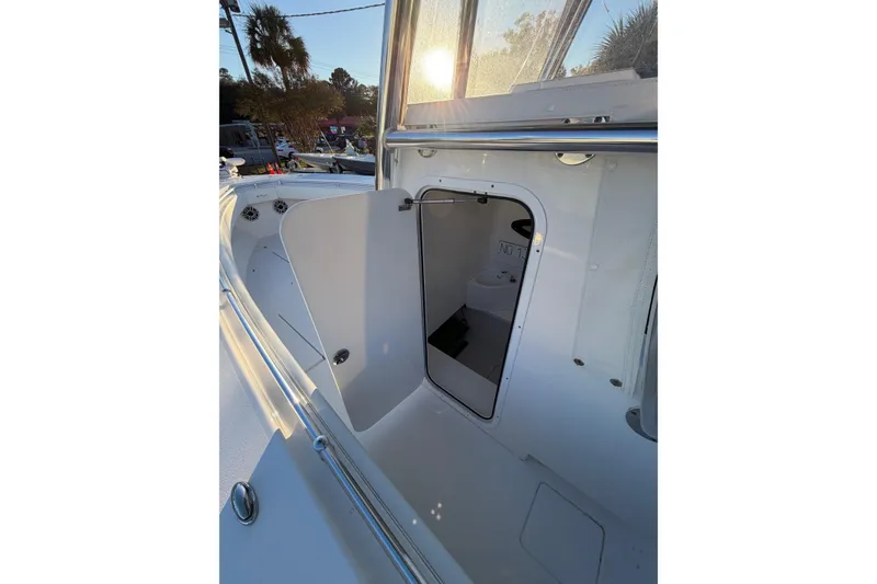 Slide: The Image of 2020 Contender 32 ST boat interior with open hatch, sunlight streaming in. - 63